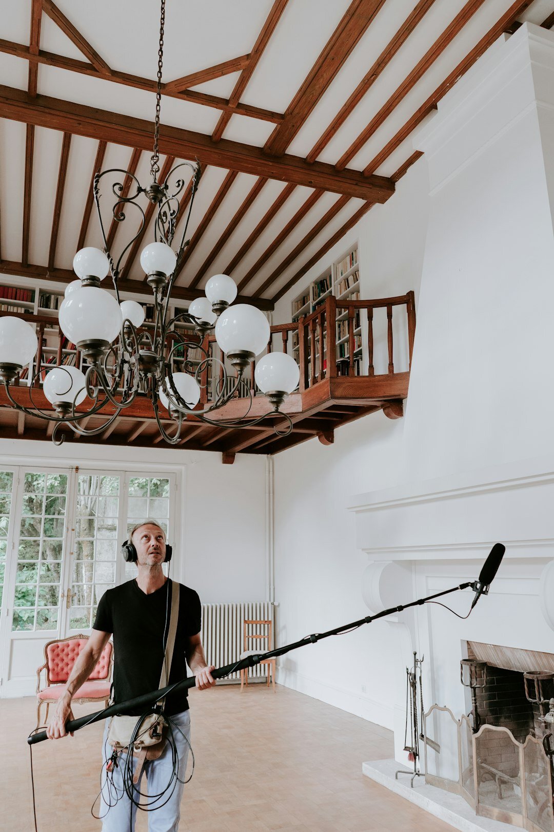 Small film set with a lighting rig and boom microphone
